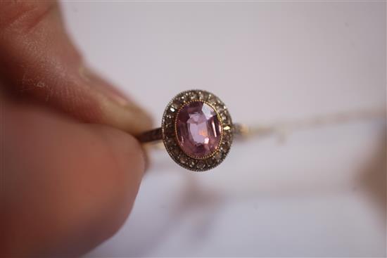 A gold, pink topaz and diamond oval cluster ring, size P.